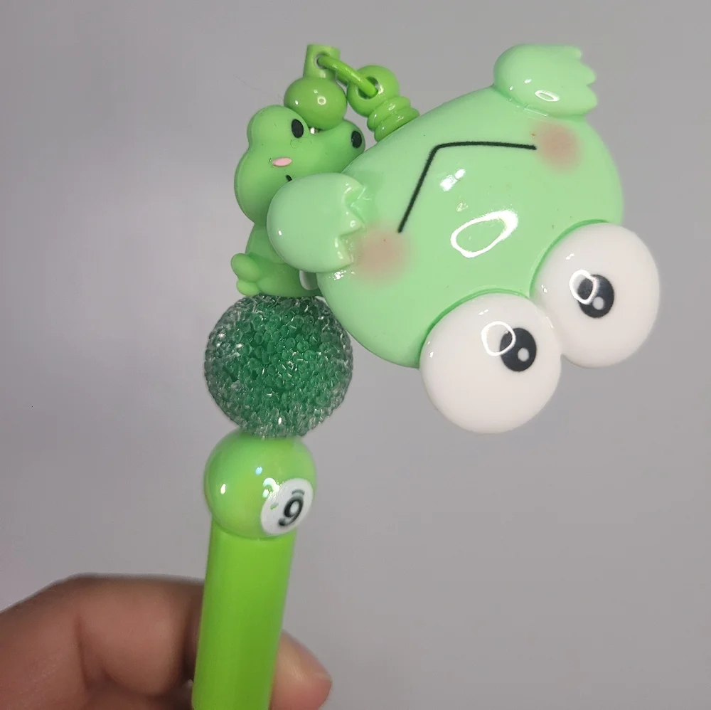 Green frog pen. Homemade and with a clip so you don't lose it.